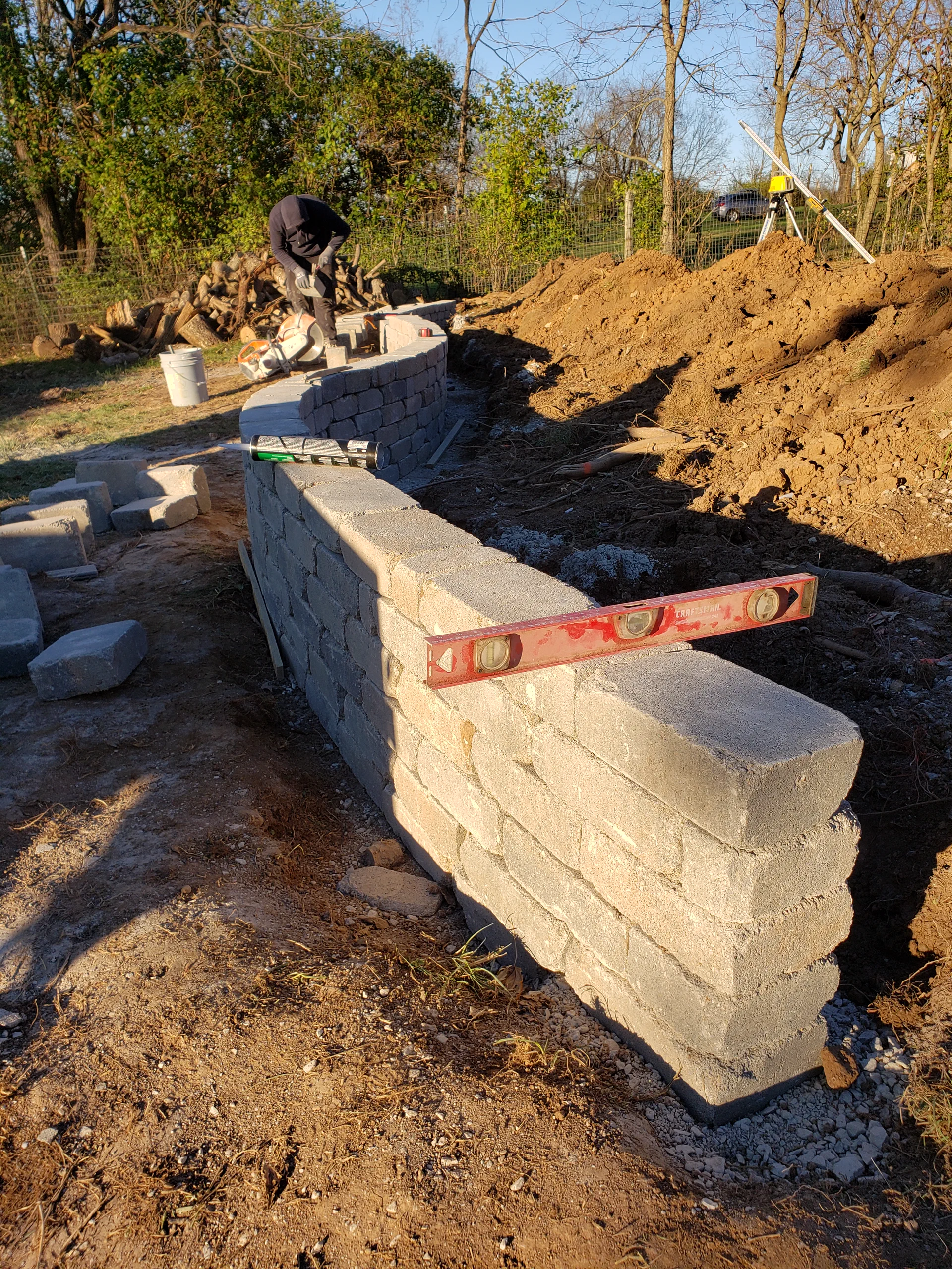 Reliable Outcomes Excavation block retaining wall installation.
